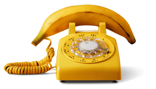 Yellow Rotary telephone with a Banana has a receiver