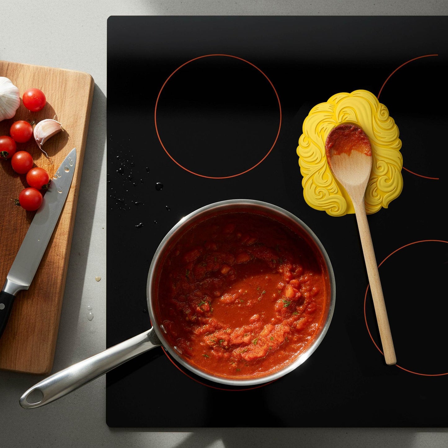 Dolly Parton Spoon Rest on Stove Top with Tomatoe Sauce
