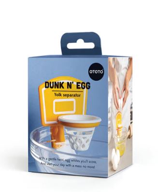 Dunk N' Egg packaging—because your breakfast deserves a slam dunk. Mini basketball hoop yolk separator perched over a glass bowl, ready to drain those whites.