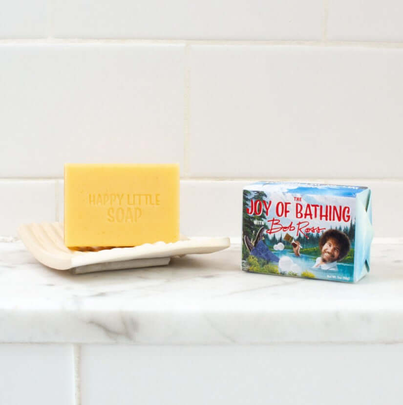 The Joy of Bathing with Bob Ross bar of soap unwrapped. Soap stamped with Happy Little Soap.