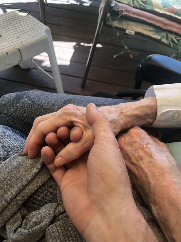 Gavin holding his mom's hands