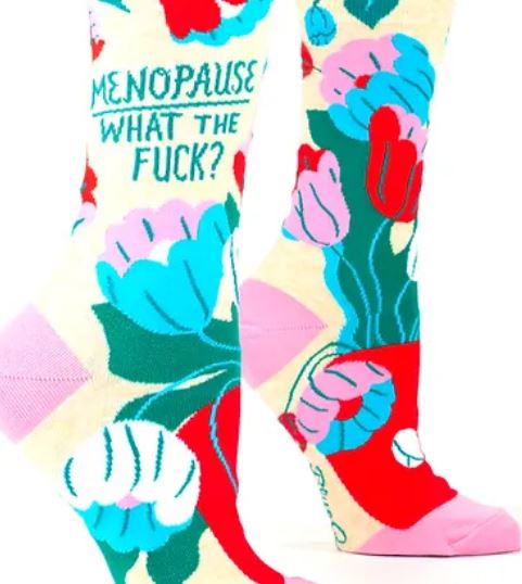 Bright, flowery socks that say Menopause What The Fuck?