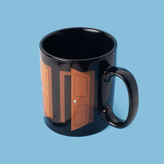 Proud Closet Heat Changing Mug with closed closet doors design before heat activation, on blue background