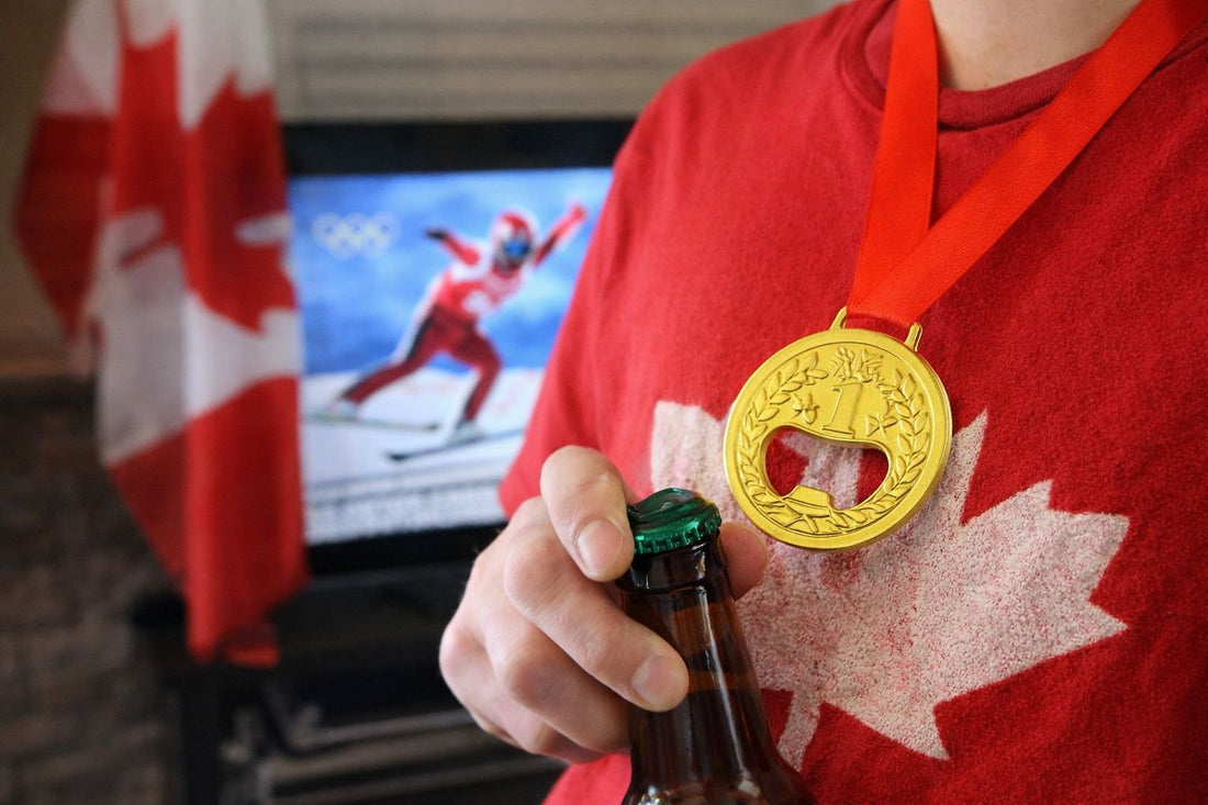 Gold medal bottle opener worn around the neck while opening a drink during an Olympic watch party in Canada