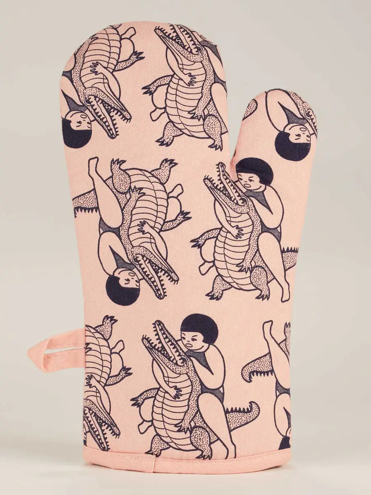 Do One Thing Every Day That Scares Your Family Oven Mitt with humorous alligator wrestling print on display