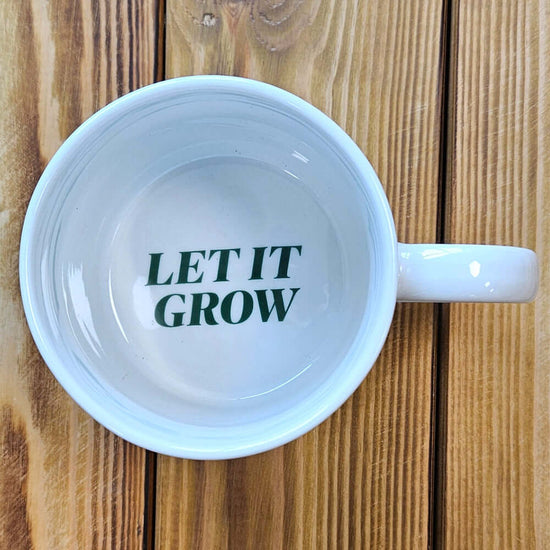 Freshly Picked Puns Mug with the words 'Let It Grow' inside.
