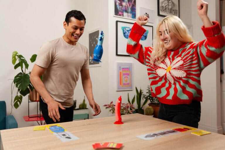 Two friends playing Chicken Vs Hot Dog action party game and having fun