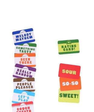 The image shows a stack of colorful game cards from Pickles The Quick Action Party Game by Danna Bananas. The left side features cards with phrases such as "MELODY MAYHEM," "SOMETHING TASTY," "BEEN THERE," "REALLY RANDOM," "PEOPLE PLEASER," and "LET'S PLAY." On the right, cards read "RATING CARD!," "SOUR," "SO-SO," and "SWEET!".