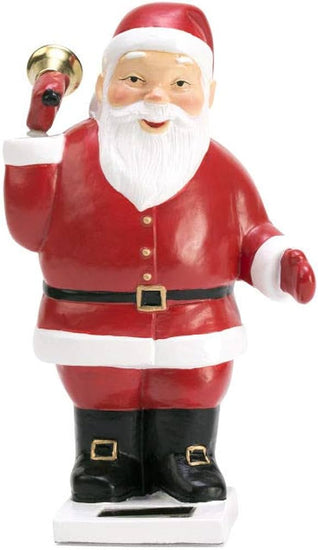 A solar-powered statue of Santa Claus holding a bell.