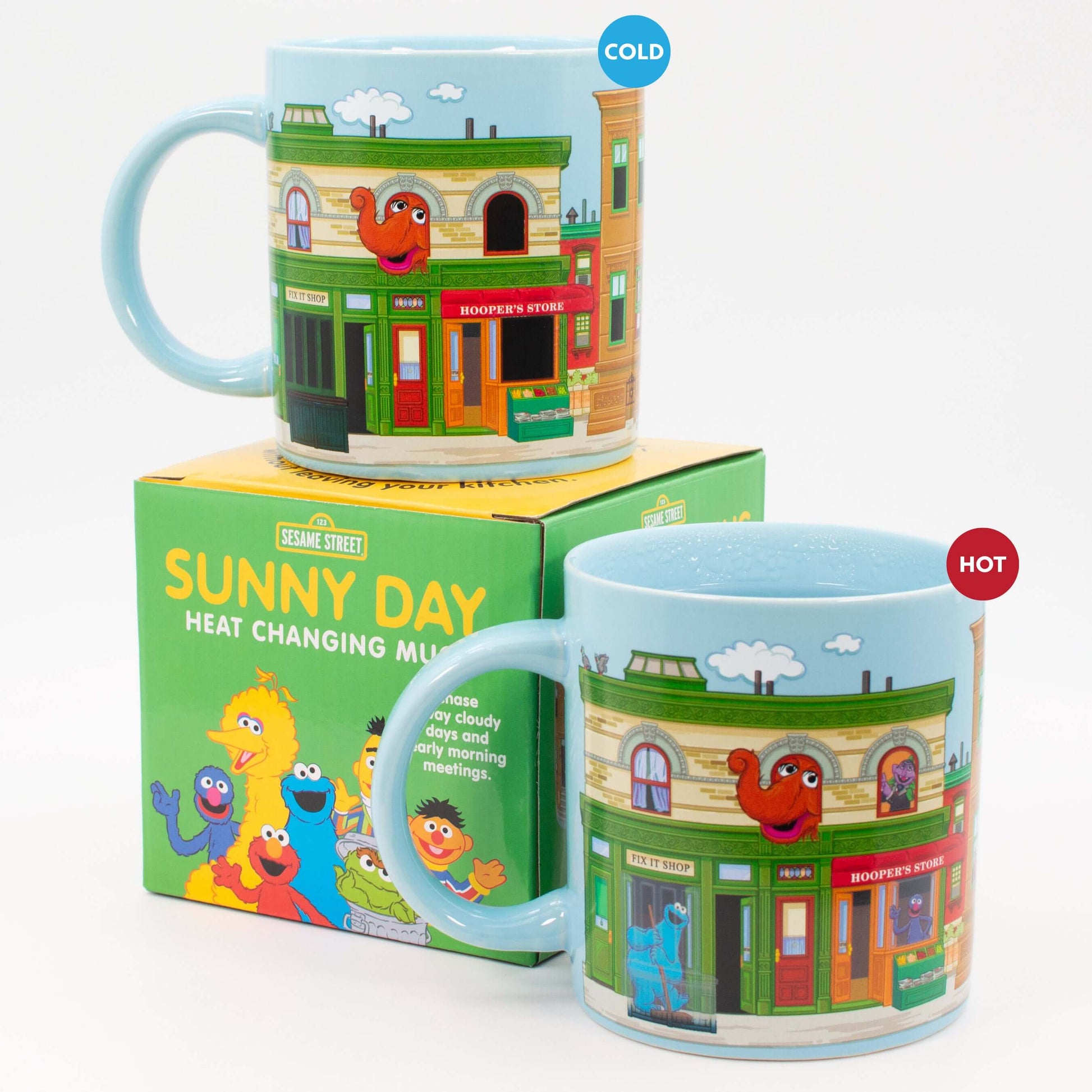 Sesame Street Sunny Days Heat Change Mug shown cold and hot with characters revealed beside the colourful gift box.