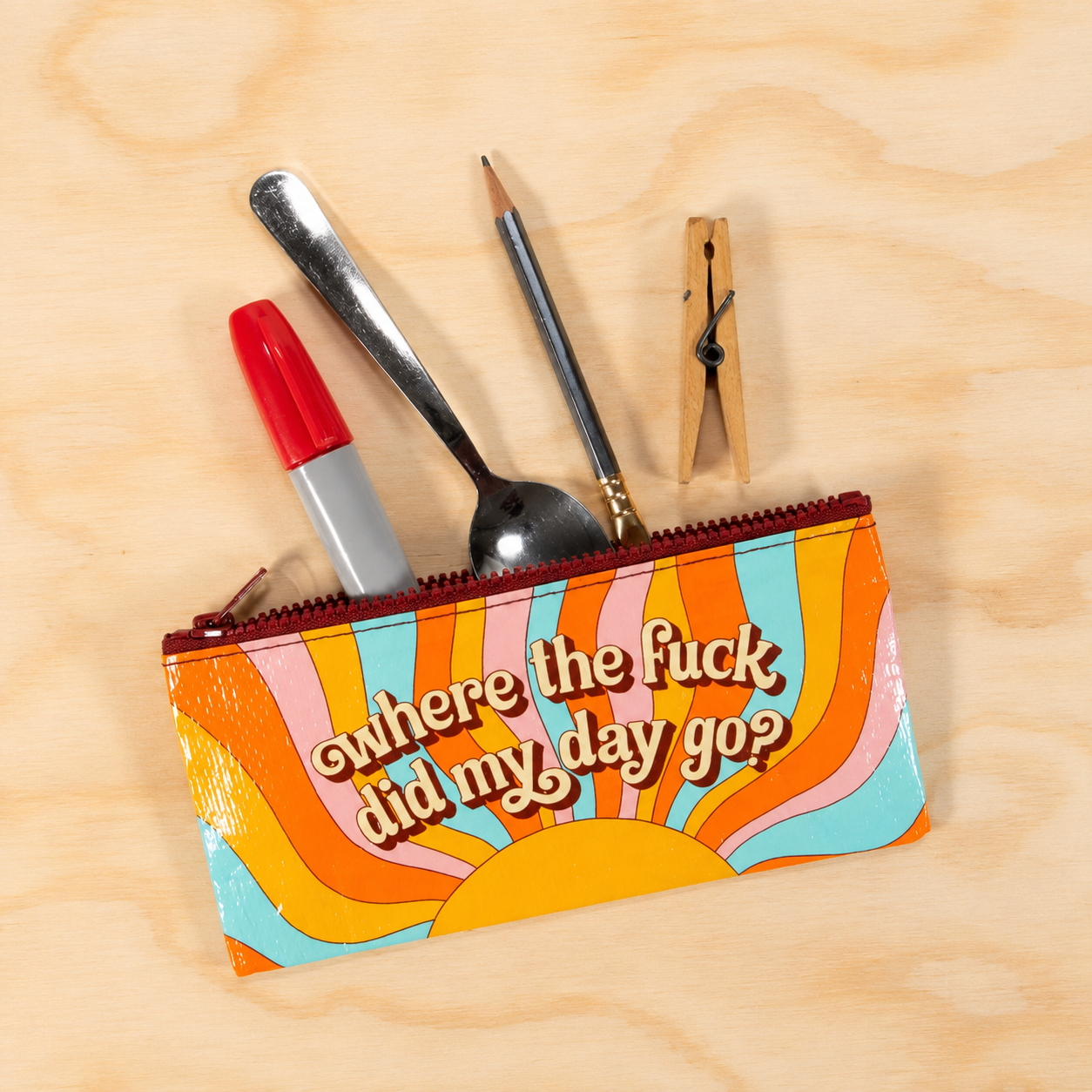 Blue Q retro pencil case holding a marker, pencil and assorted small items