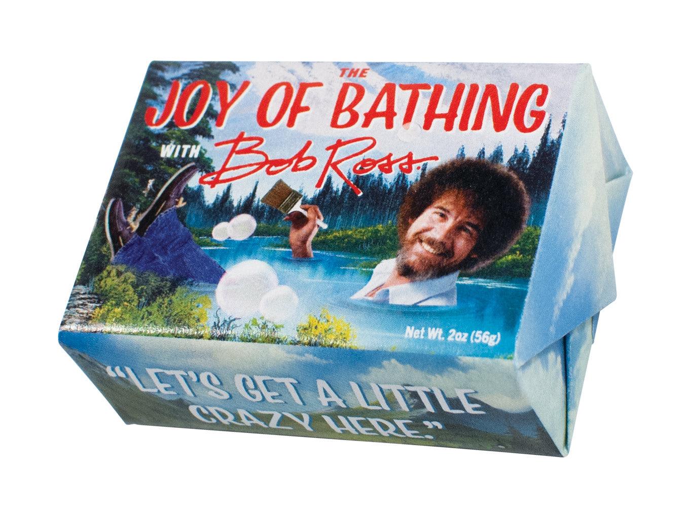 The Joy of Bathing with Bob Ross Bar of Soap wrapped in paper displaying Bob Ross painting.
