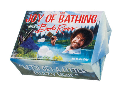 The Joy of Bathing with Bob Ross Bar of Soap wrapped in paper displaying Bob Ross painting.