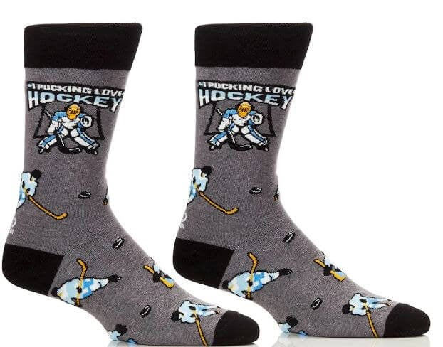 I Pucking Love Hockey funny socks by Danna Bananas featuring a cartoon goalie, hockey sticks, and pucks on a grey background—fun novelty gift for hockey fans.