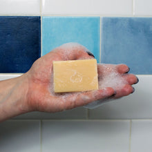 Jean-Luc Picard's Make It Soap Earl Grey Scented Bar of Soap all lathered up in someone's hand.