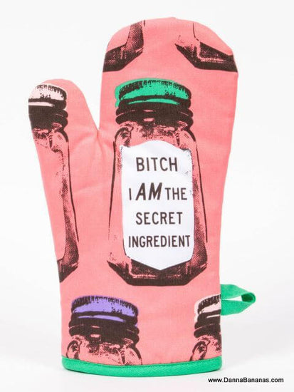 A pink oven mitt that says Bitch I am The Secret Ingredient