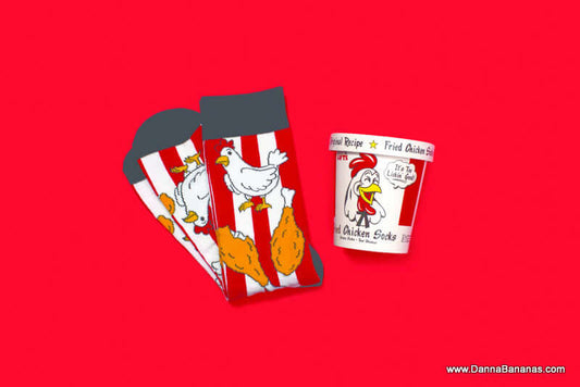 Socks with a picture of chicken and two chicken legs on them. Plus, a bucket with a picture of a chicken and the words, Fried Chicken Socks