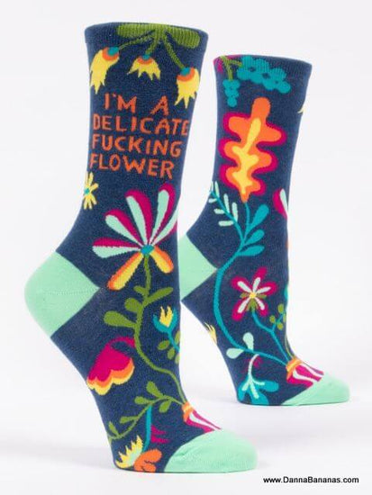 These socks are dark blue, with multi-coloured flowers and the text is, I'm A  Delicate Fucking Flower.    