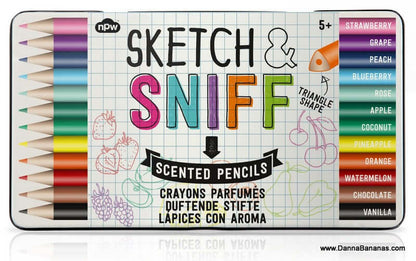 Image of a vibrant collection of triangle-shaped scented pencils from NPW, named "Sketch & Sniff Scented Pencils." These delightful pencils come in fruity scents such as strawberry, grape, and peach, among others. The lively packaging showcases vivid fruit illustrations. Ideal for creative individuals aged 5 and up!