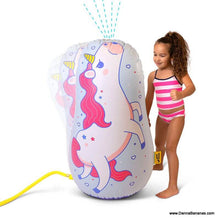 Child playing with inflatable unicorn sprinkler that wiggles and sprays water – funny summer toy for kids