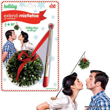 A product package titled "Extend-Mistletoe" by Danna Bananas showcases a retractable rod with mistletoe at the end. A couple is seen kissing under the mistletoe on the right side of the image. The text on the package reads "Holiday kisses on-the-go!" and "Extends 30 inches"—perfect for the Christmas season!