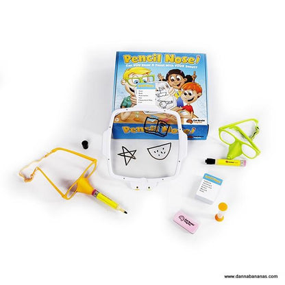 The image showcases a lively party game called "Pencil Nose Game" by Danna Bananas, featuring nose-shaped glasses, markers, drawing cards, and an eraser. Perfect for interactive family games, the colorful box bursts with playful cartoon illustrations sure to spark joy in any gathering.