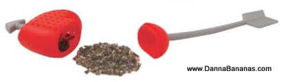 The Tea to My Heart Tea Infuser by Danna Bananas is a stylish heart-shaped red kitchen gadget featuring a plunger and loose tea leaves, making it the perfect tool for brewing the ideal cup of tea. This charming infuser also serves as an excellent Mother's Day gift. The image contains a URL at the bottom right corner.